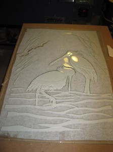 Spoon bill cranes in recycled window glass